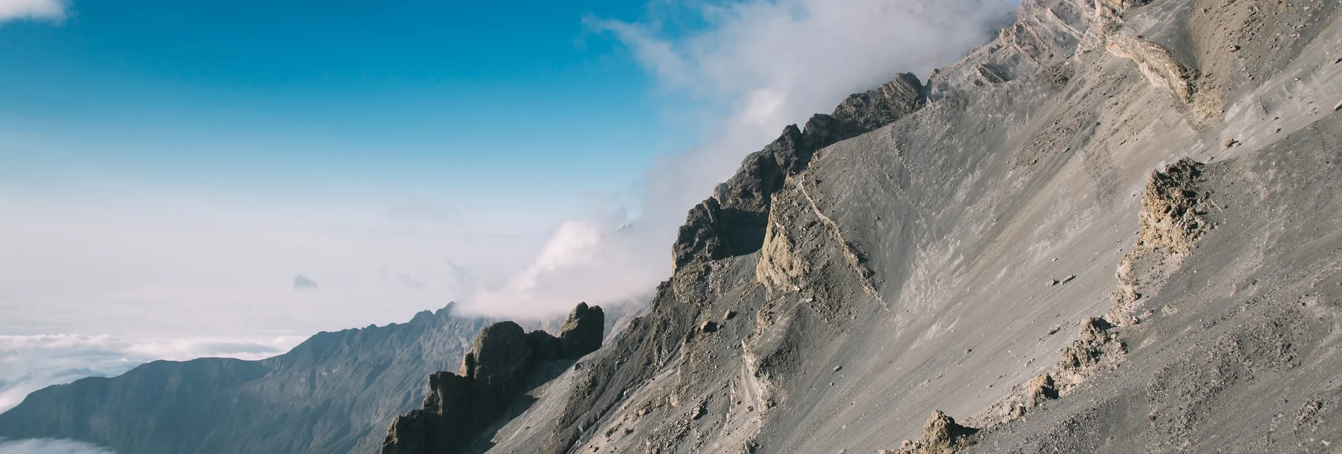 Trekking group on Mount Meru with Kilimanjaro view